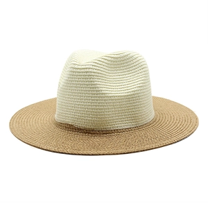 Detailed top view of a two-tone straw Panama hat featuring fine weave and a wide brim