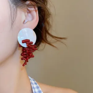 Artistic round shell and red coral branch dangle earrings for women in new Chinese style