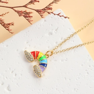 Rainbow enamel necklace with gold plating and zircons on white stone display