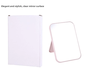 Pink foldable desktop vanity mirror with adjustable stand and white gift box packaging