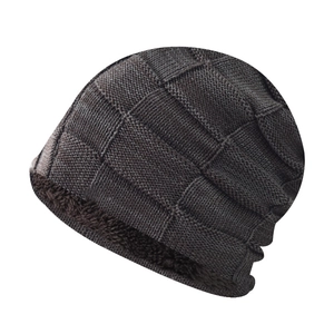 Detail of winter plaid knit hat with soft fleece lining for extra warmth and insulation