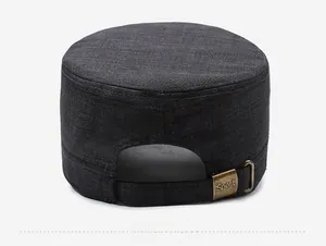 Detail of the adjustable bronze metal buckle with Sport text on the charcoal flat cap