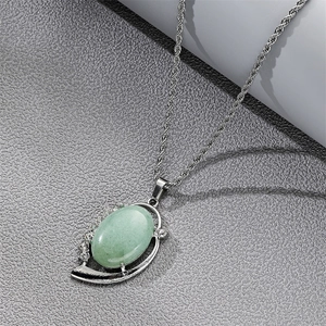 Vintage silver twisted chain necklace featuring an oval light green natural stone pendant