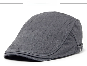 Close-up of ivy cap with grey-black cotton texture and wavy stitching detail