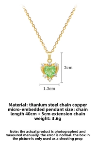 Detail of green heart zircon pendant necklace with gold titanium steel chain