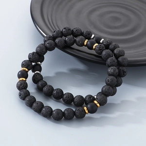Close-up of 8mm lava rock and matte agate beads bracelet with metallic spacers