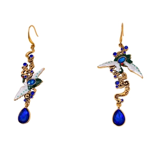 Exquisite gold crane earrings with colorful enamel and inlaid blue gemstones on white back