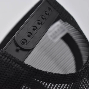 Detailed view of the adjustable seven-hole snapback closure on a black mesh trucker hat