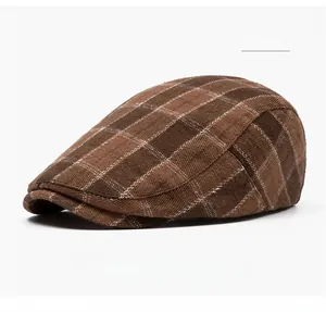 Detailed texture of coffee plaid newsboy cap featuring vintage brown woven fabric
