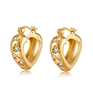 Detailed view of gold plated heart hoop earrings featuring star shaped cubic zirconia settings