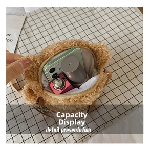 Internal capacity of the brown plush bear shoulder bag holding phone and lipstick