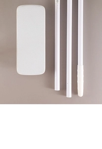 Detailed view of the flat mop base and three-segment assembly pole set in white