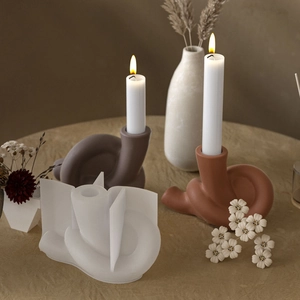Silicone mold for creating modern twisted rope knot candle holders in resin or plaster
