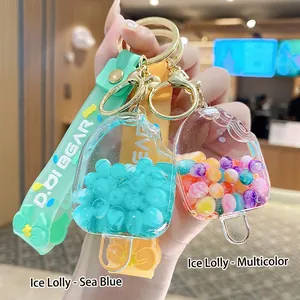 Cute acrylic popsicle keychain with colorful moving beads and soft mint green wrist strap