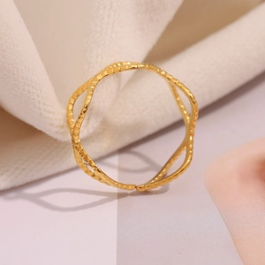 Macro detail of 18K gold plated ring featuring a double-layer wave design and beaded texture