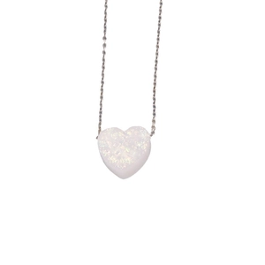Minimalist silver chain necklace with heart-shaped white opal stone pendant on white background