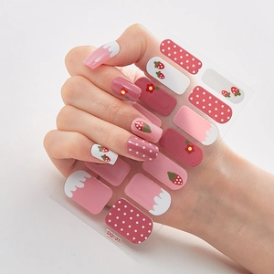 Detail of pink strawberry and polka dot 3D nail stickers model DQ-31 on nails