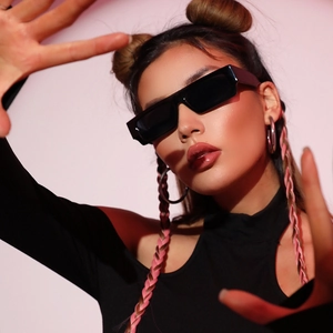 Trendy women's rectangle black sunglasses featuring narrow frames and retro punk style