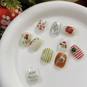 Christmas press-on nails with embossed red flowers, dog and festive sock patterns