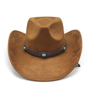 Detail of brown suede cowboy hat with turquoise beads and metal studs on leather band