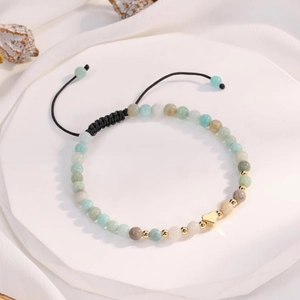 Detail of Amazonite beaded bracelet with adjustable black cord and gold heart charm