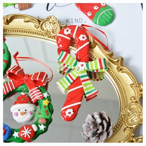 Detailed close-up of festive polymer clay ornaments including candy cane and wreath