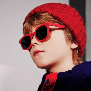 Polarized kids sunglasses with red frames and black lenses for stylish sun protection