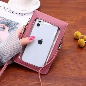 Pink leather mini crossbody phone bag with touch screen window and gold metal hooks