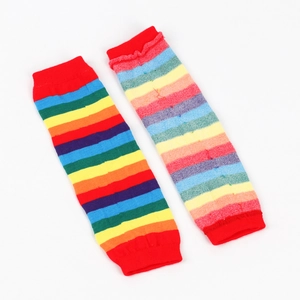 Detail view of rainbow striped knitted leg warmers with elastic ribbed cuffs on white back