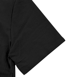 Close-up of sleeve stitching and linen texture on black short sleeve casual shirt