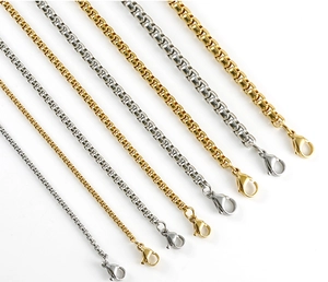 Detail of stainless steel box chains in gold and silver colors with lobster clasps
