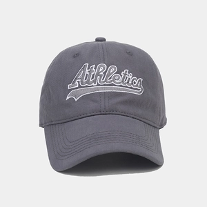 Detail of white Athletics embroidery on a dark grey cotton baseball cap with soft top