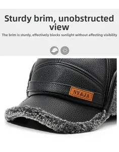 Detail of winter leather baseball cap with grey fur trim and stitched logo patch