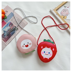 Cute fruit-shaped children crossbody bags in strawberry and peach styles with woven straps