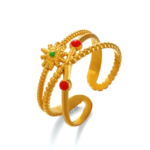 Bohemian gold sunburst ring with colorful green and red beads on minimalist band