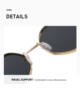 Detail of soft silicone nose pads on lightweight light gold metal sunglasses frame