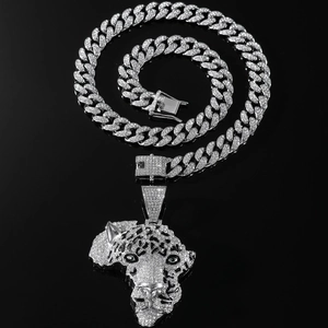 Silver cuban link chain featuring a sparkling full diamond iced out leopard pendant