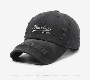 Detail of black vintage distressed cotton baseball cap with Mizoohean embroidery