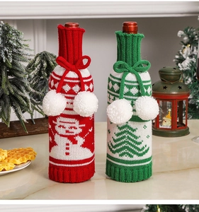 Detailed knit Christmas wine bottle covers featuring snowman and tree patterns for decor