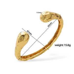 Gold open bangle with irregular hammered texture and product dimensions specification
