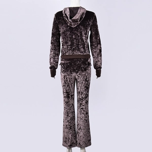 Detail of dark brown crushed velvet tracksuit with flared pants and hoodie back view