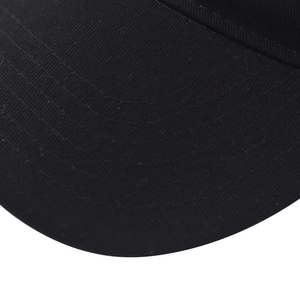 Detailed close-up of high-density twill cotton fabric and stitching on a black baseball cap