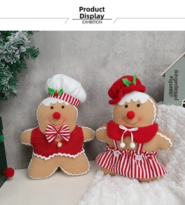 Detail of fabric gingerbread man dolls with chef hats and sequin vests for Christmas decor