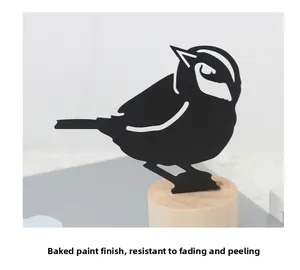 Detail of black bird silhouette with baking paint finish on a solid wooden base