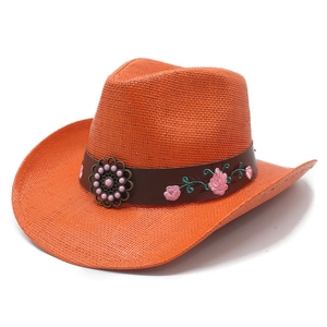 Classic orange straw western cowboy hat with floral embroidery and decorative band