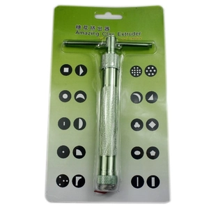 Macro view of the Amazing Clay Extruder set with 20 metal template discs in green