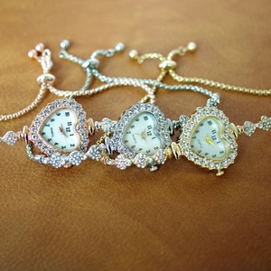 Women's heart-shaped rhinestone quartz bracelet watch in gold, silver and rose gold