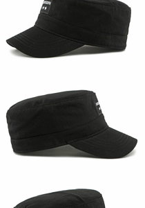 Detail view of black flat top military cap featuring star logo and side lettering patches
