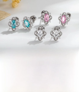 Macro detail of retro flower studs with colorful zircons and titanium steel posts