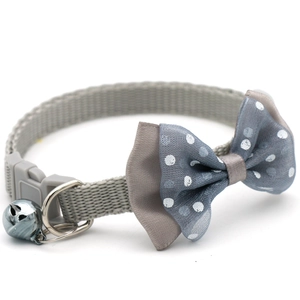 Grey pet collar with white polka dot bowtie, durable nylon webbing and metal bell for cats